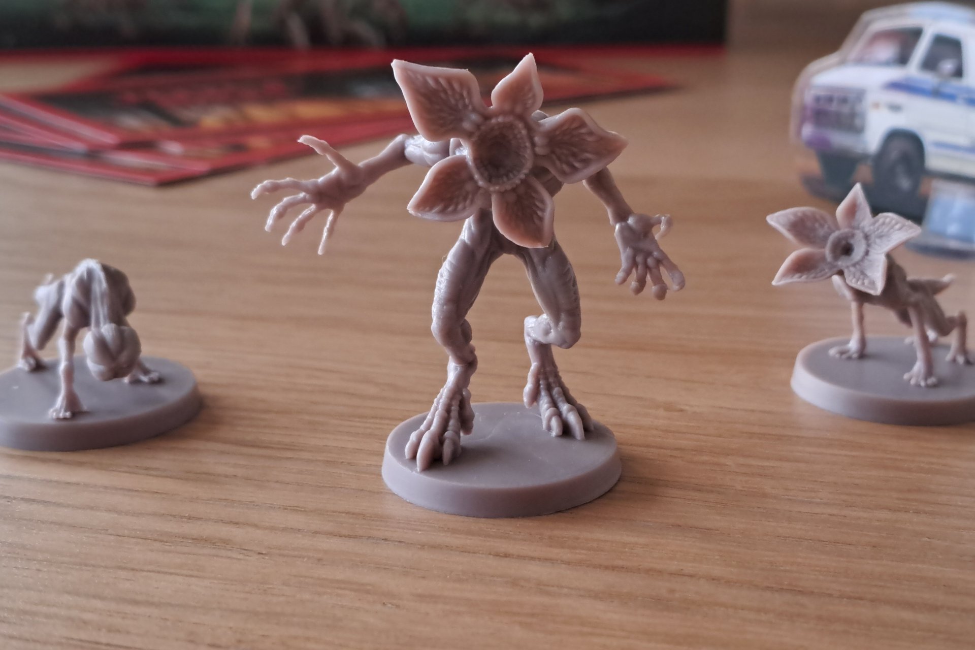 Three plastic Demodog figures from Stranger Things board game