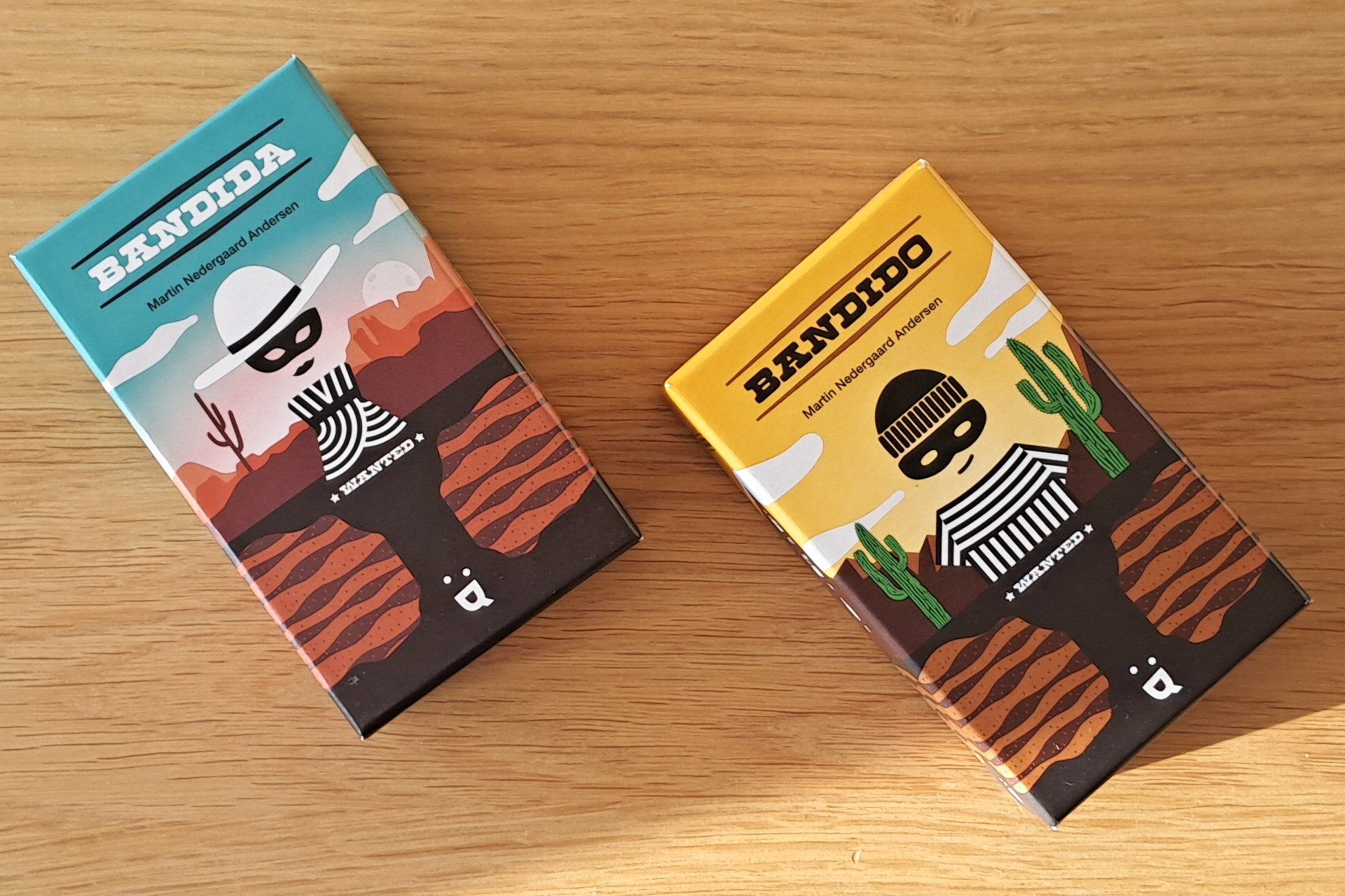 Bandido and Bandida card game boxes, side by side