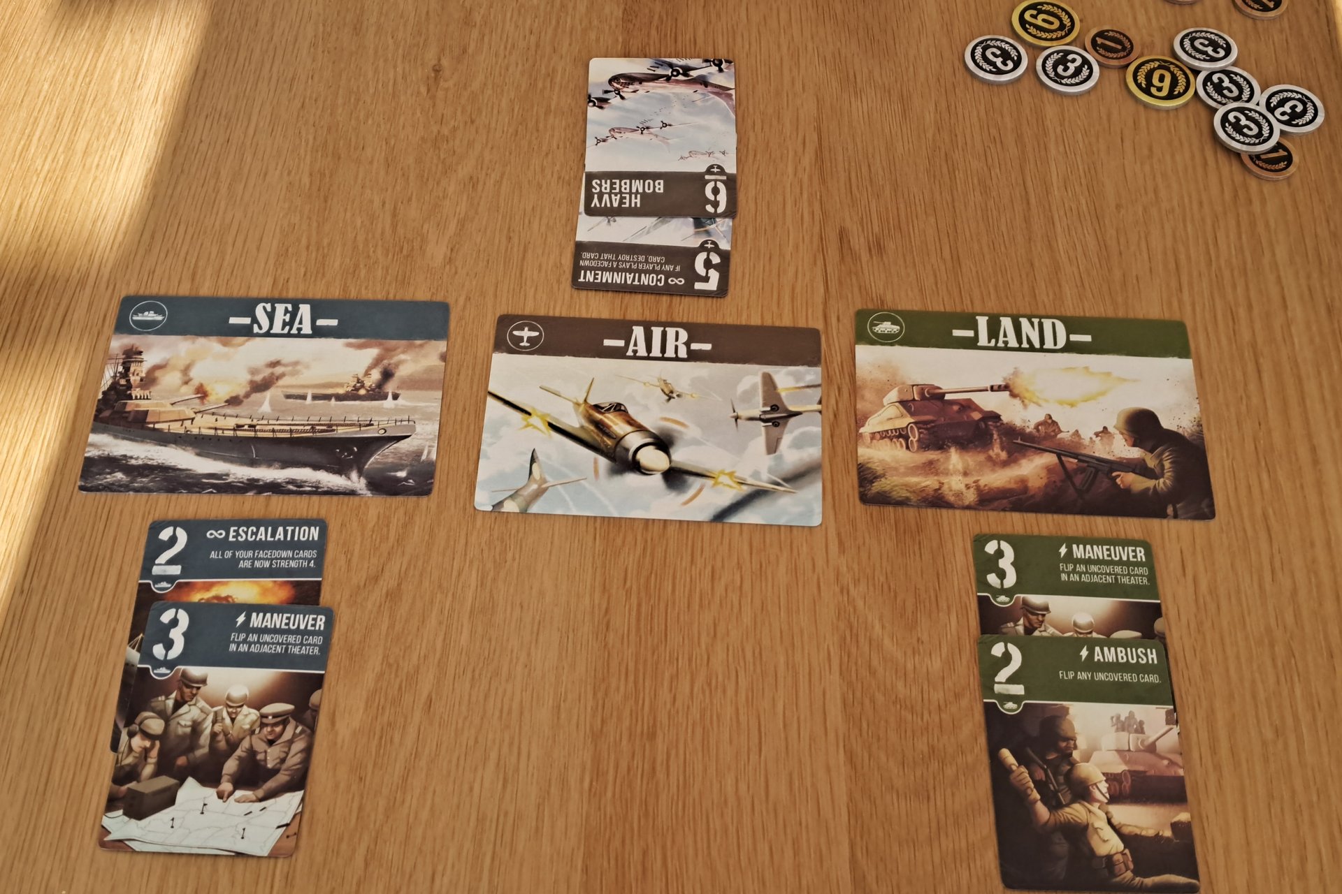Air, Land & Sea gameplay, showing the three theater cards and cards in play