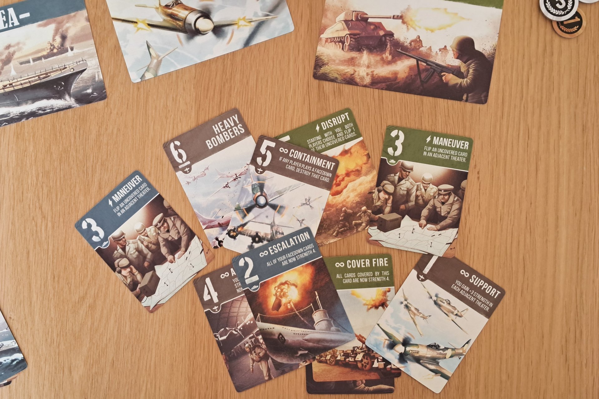 Close up of the Air Land & Sea cards on the table