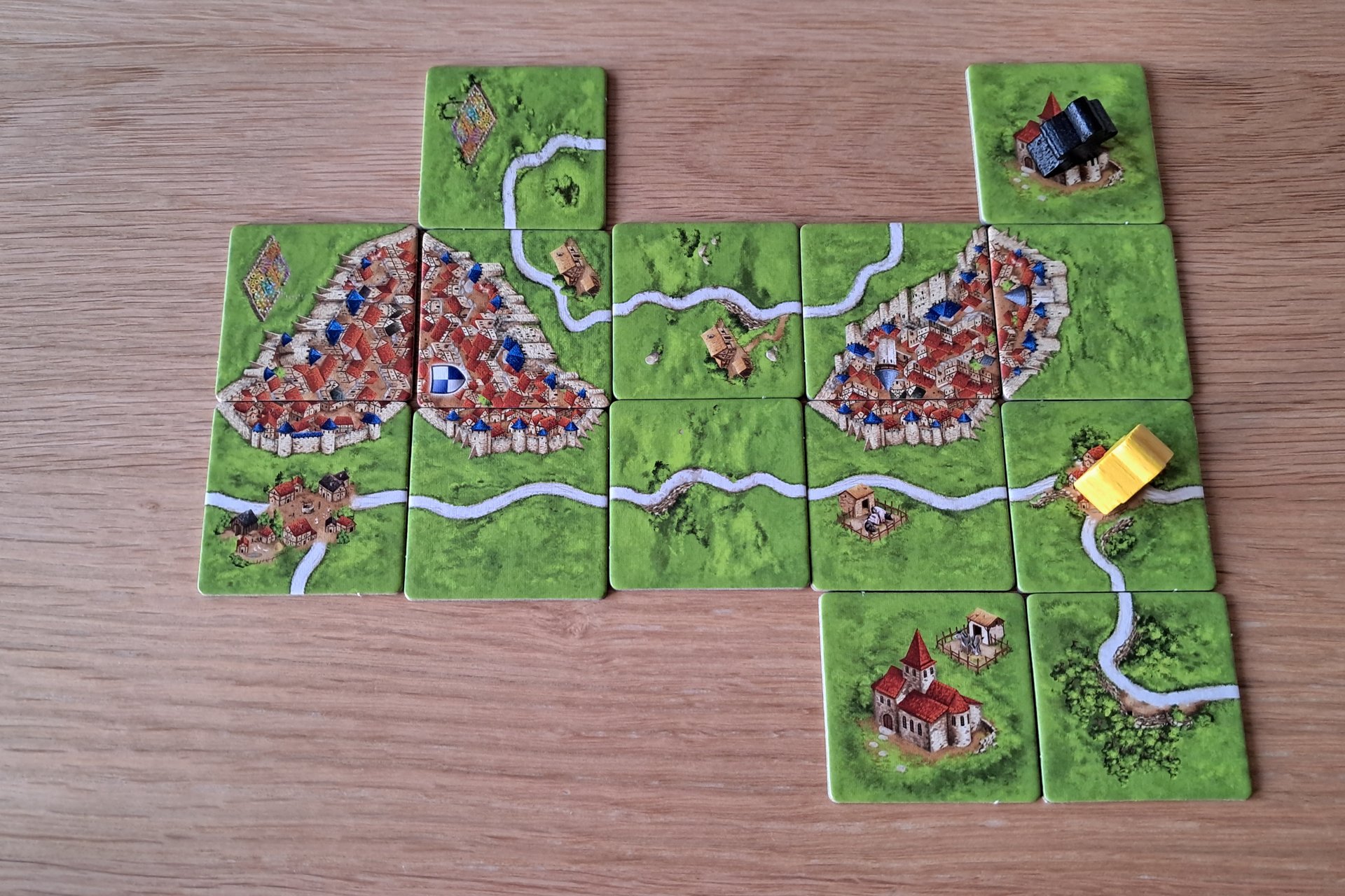 Carcassonne game in progress showing cities, roads, and farms