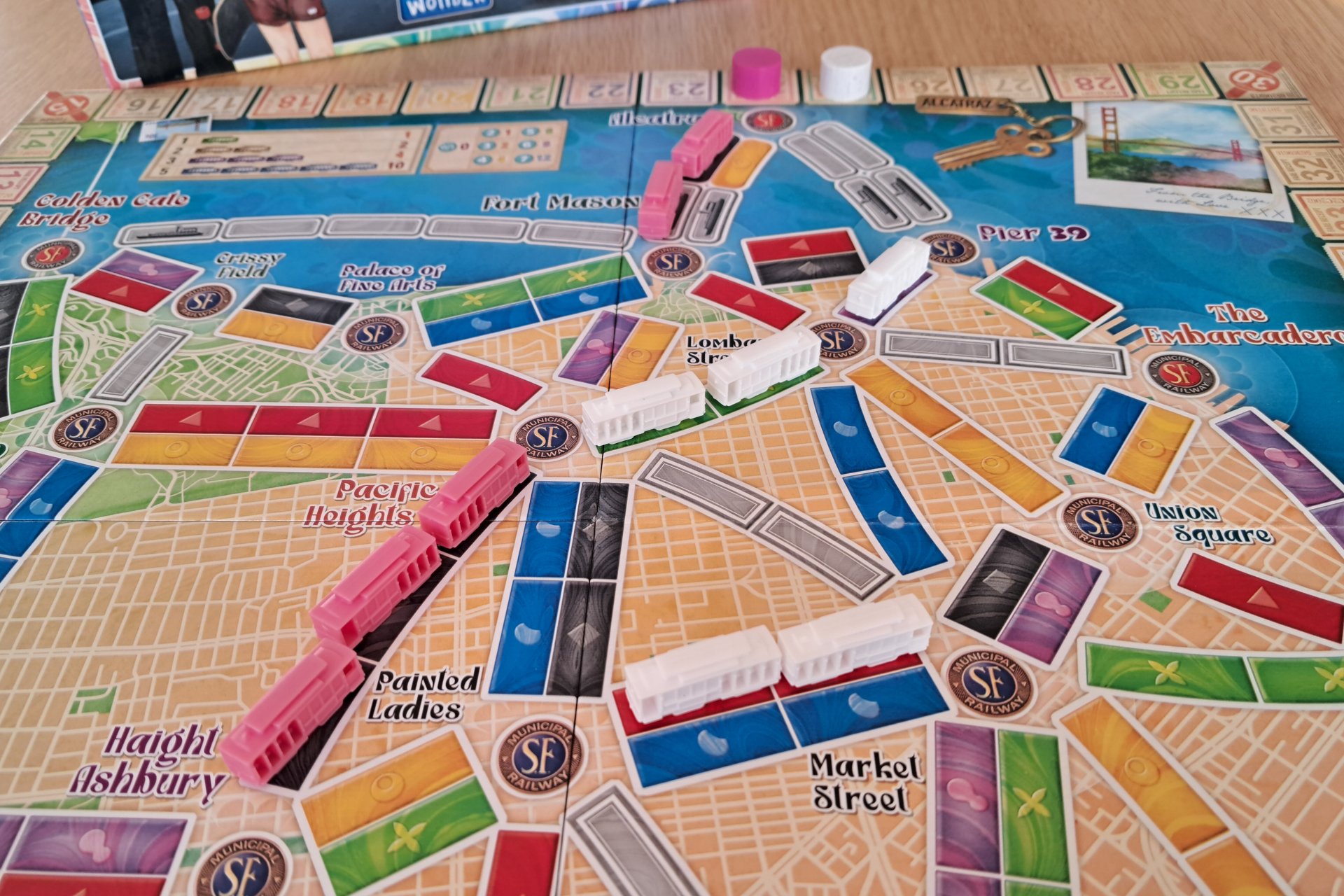 Close up of the Ticket to Ride San Francisco game board showing the city map and tram routes with trams placed on routes.