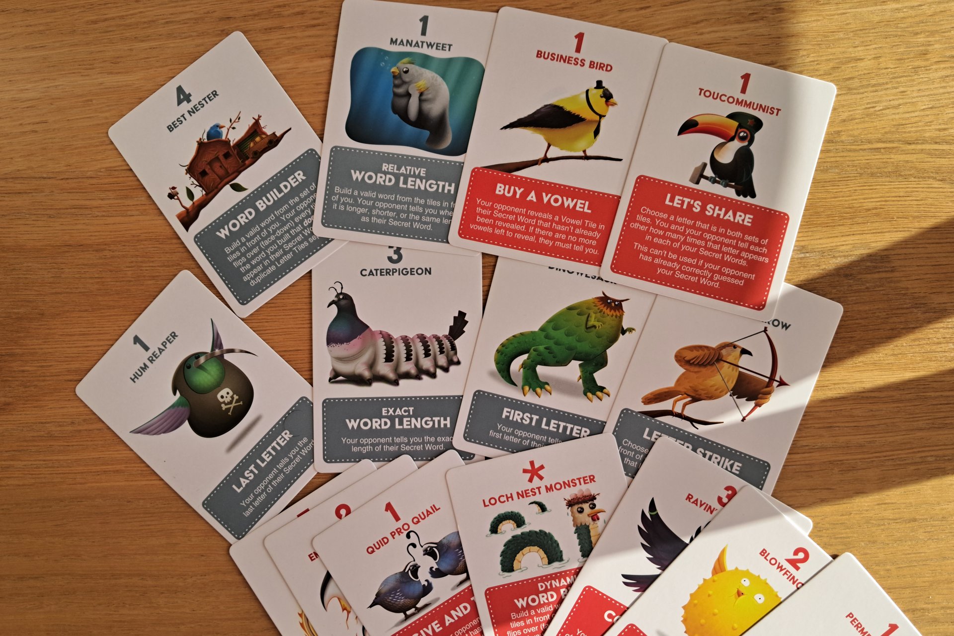 A close up of the clue cards from A Little Wordy spread out on the table.