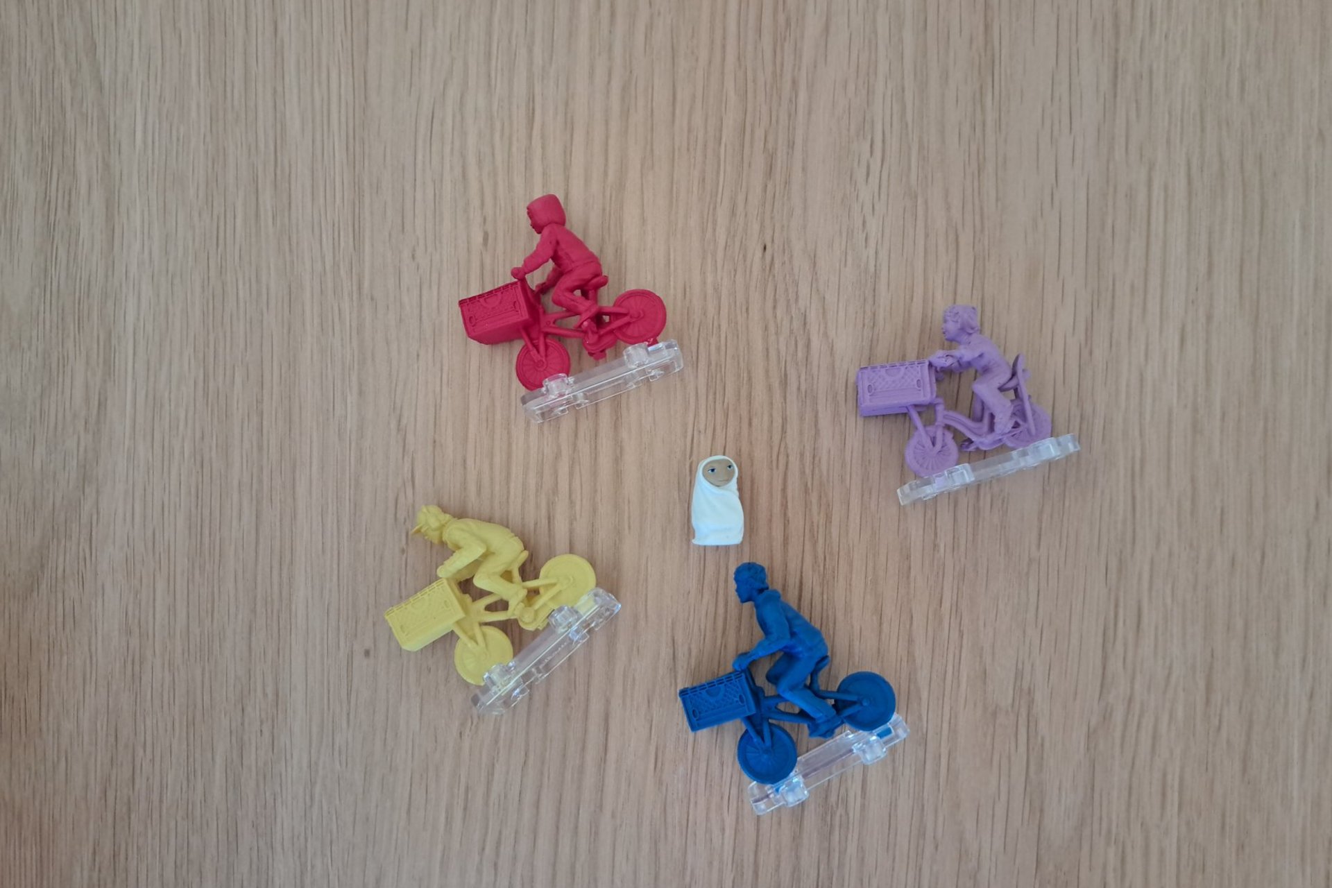 A close up of the four kid figures and the E.T. figure from the E.T. The Extra Terrestrial game.