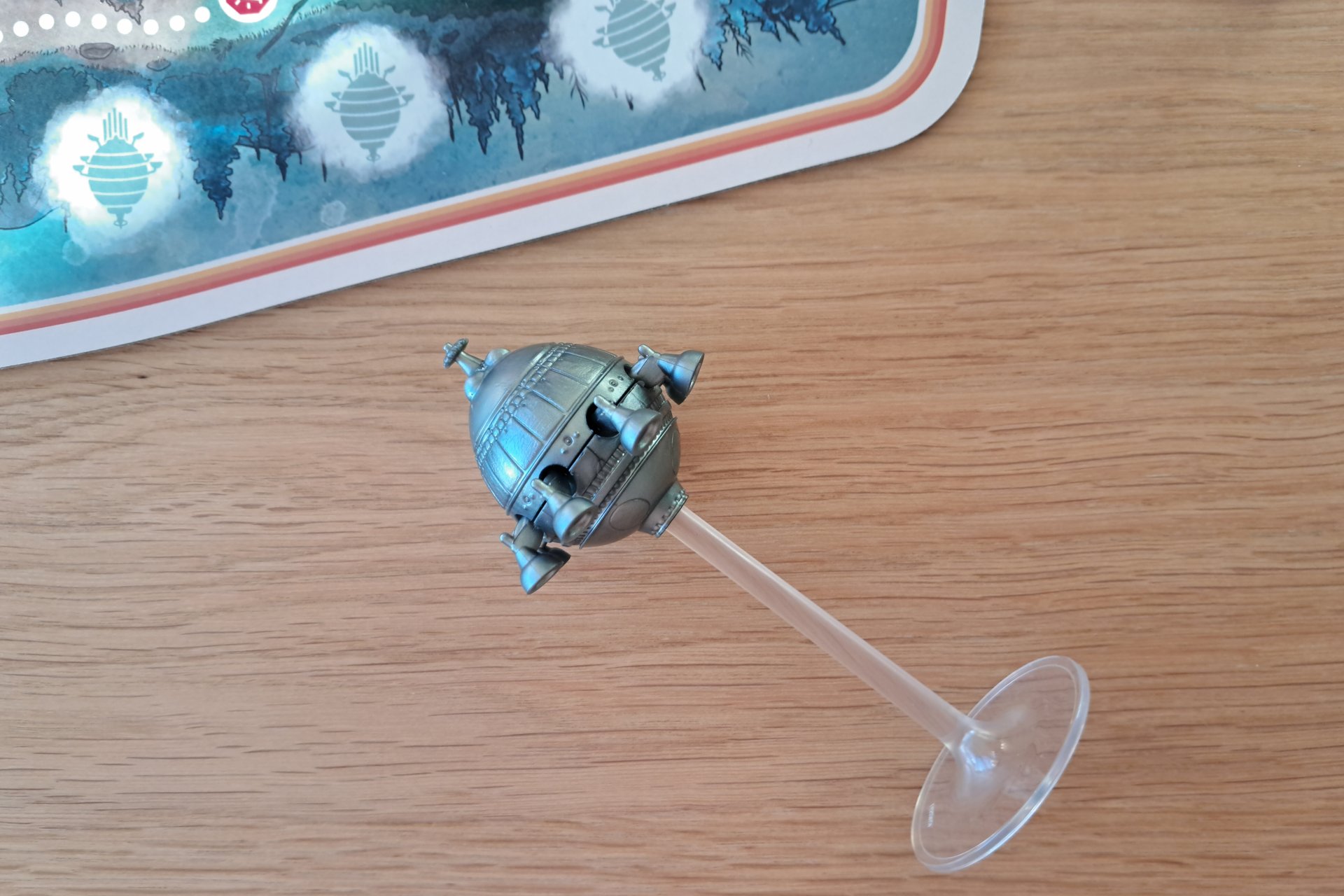 A close up of the mothership figure from the E.T. The Extra Terrestrial Light Years From Home board game.