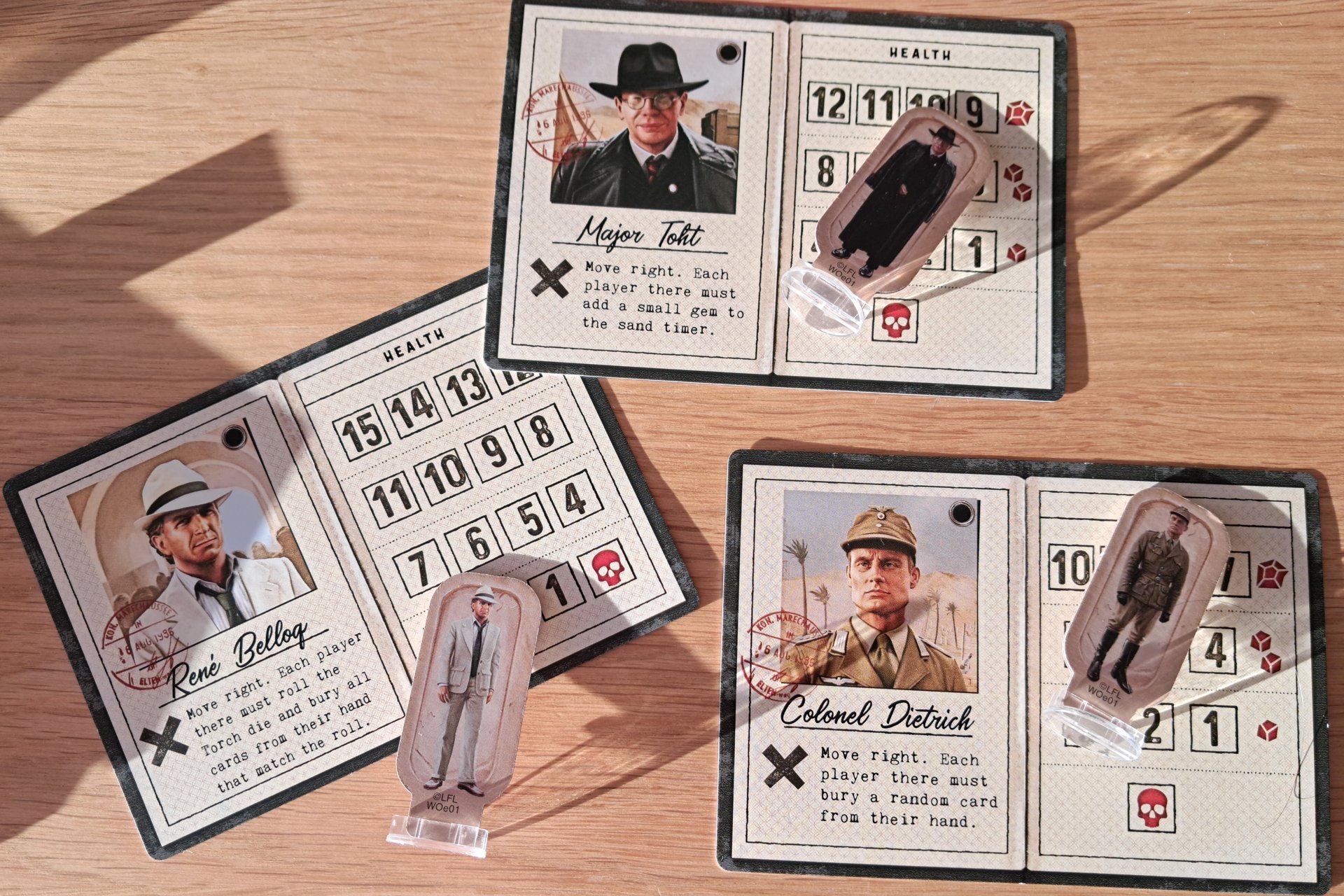 Enemy character cards and pawns from the Indiana Jones Sands of Adventure board game.