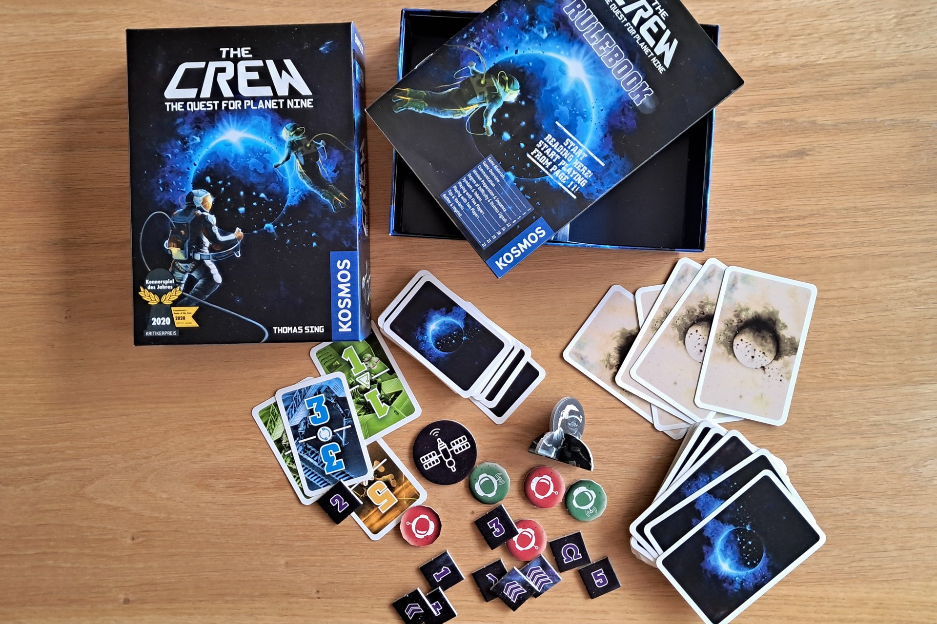 The Crew The Quest for Planet Nine box opened, showing all cards and game components.