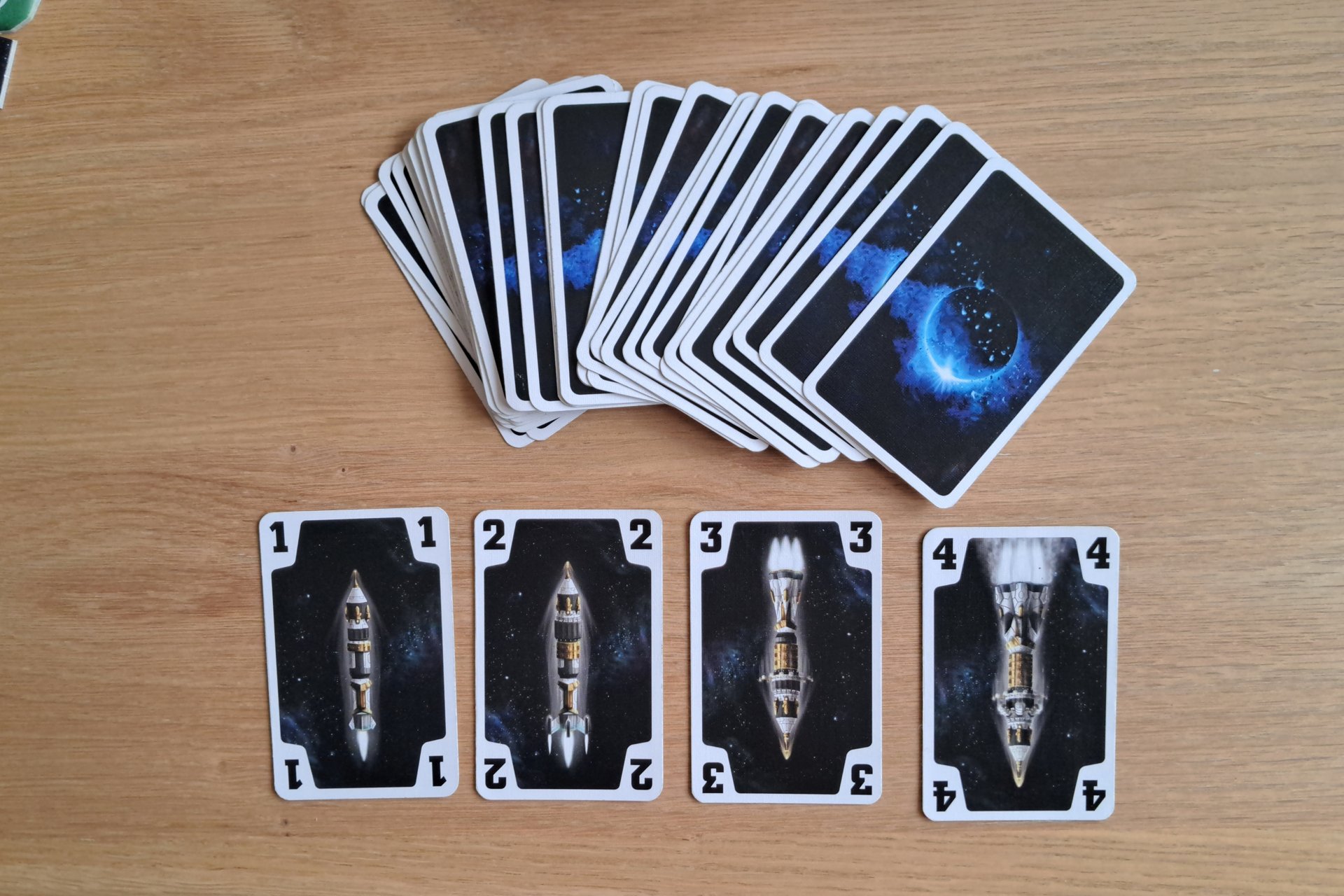 The four rocket cards laid out on the table.